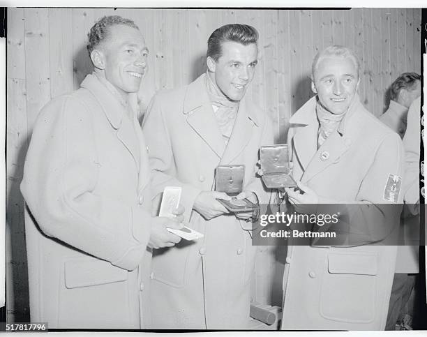 The winners of the Giant Slalom were three Austrians who are shown receiving their medals. Left to right are: Walter Schuster, third; Tony Sailer,...