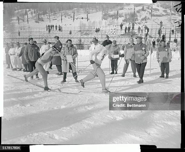 Etoshchina, , is taking over from his Russian teammate, Koltchina, , in the 15 kilometer cross country relay ski event of the Winter Olympics at...