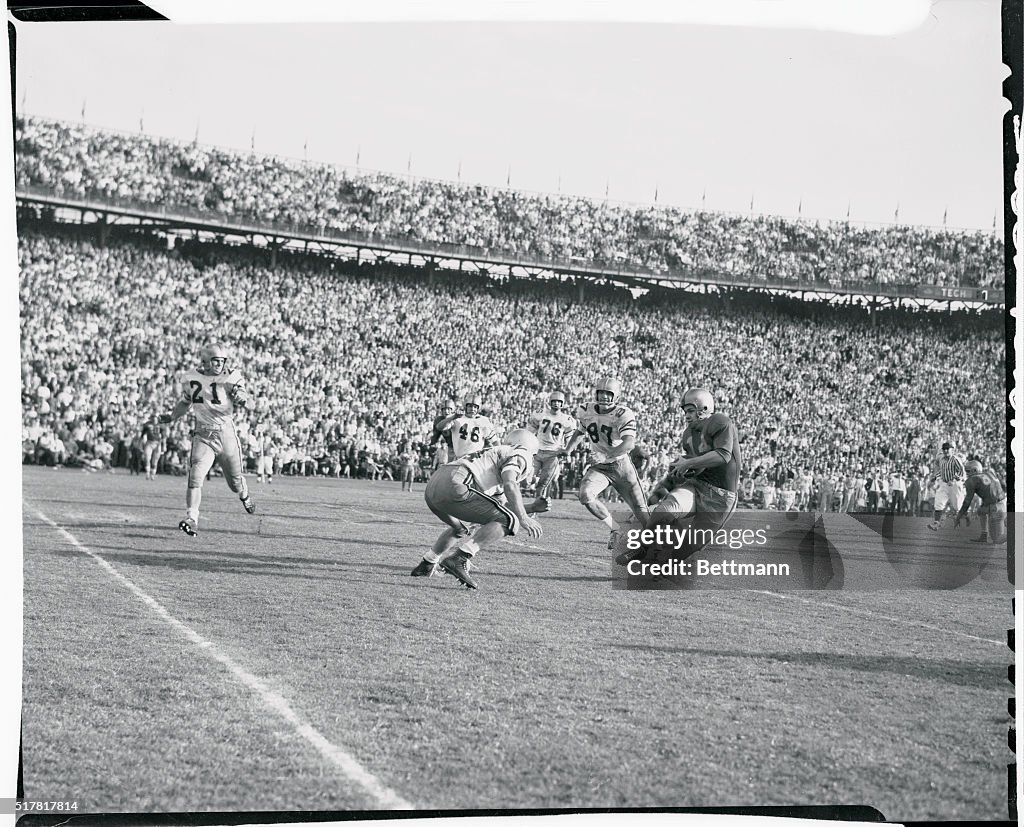 Football Player Avoiding a Tackle