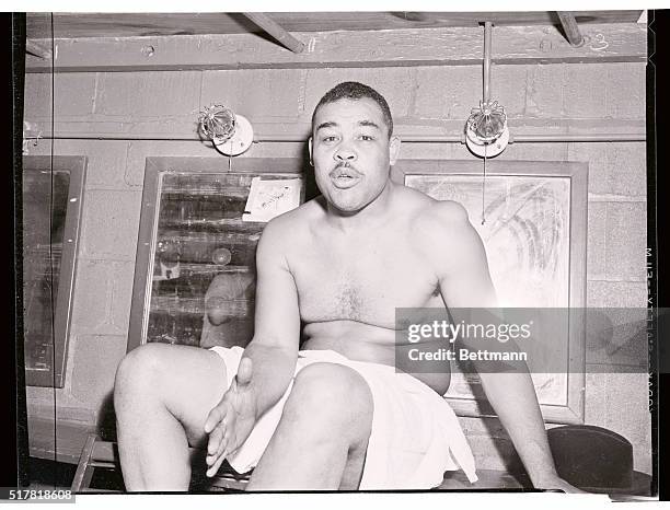 Joe Louis is shown is his dressing room after his first venture as a pro wrestler proved successful. Louis defeated Don "Cowboy Rocky" Lee in 11...