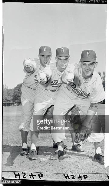 Three Brooklyn Dodger relief pitchers focus on the target and give you a close-up of their respective grips in this scene from the Vero Beach...