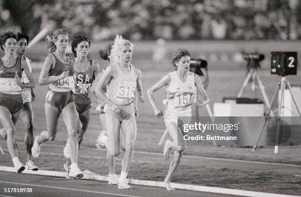 South African distance runner Zola Budd, team Great Britain, leading the 3000 meters race at the 1984 Olympics, followed by eventual gold medal...