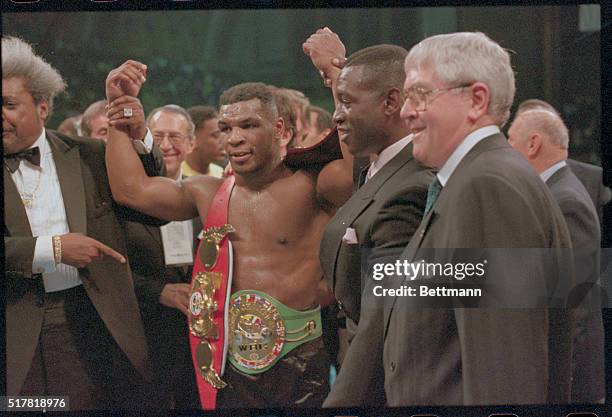 Atlantic City, N.J.: World Heavyweight Champion Mike Tyson is victorious after defeating challenger Larry Holmes. Tyson KO'd Holmes in the 4th round...