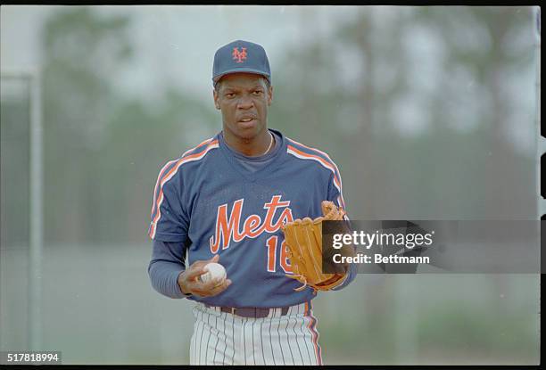 Pitcher for the New York Mets, Dwight Gooden, posing on mound.