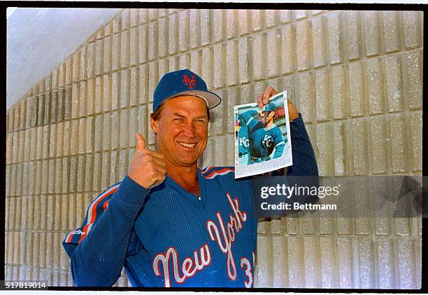 Mets' pitching coach Mel Stottlemyre, who starred with the Yankees, flashes a father's pride as he shows off a picture of his son, Mel, Jr., rookie...