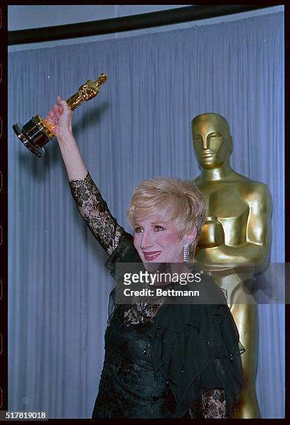 Los Angeles: Actress Olympia Dukakis holds up her Oscar for Best Supporting Actress April 11. Dukakis won for her performance in the film Moonstruck.