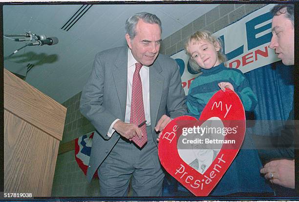 Grundy Center, Iowa: Senator Robert Dole gets and early Valentine from four-year-old Amanda Thomas, February 5th, as Dole campaigns prior to the Iowa...