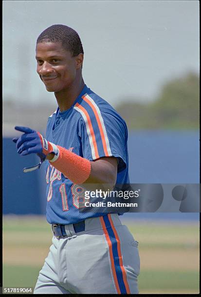 Mets outfielder Darryl Strawberry gestures and smiles as he heads to the dugout before the Mets game 3/9 with the Baltimore Orioles. Strawberry is...