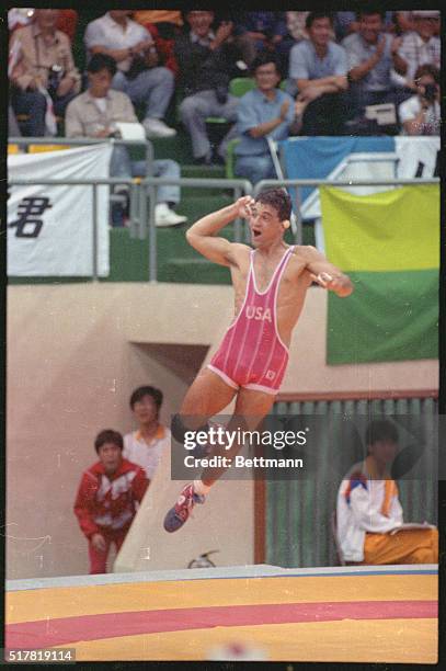 Seoul: American wrestler John Smith leaps into air after defeating Stephan Sarkissian of the Soviet Union for the gold medal in the 62 kg class...