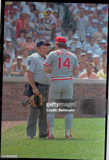 Chicago: Reds' manager Pete Rose talks with home plate umpire Bruce Froemming about line-up changes in the 8th inning of game against the Cubs. Rose...