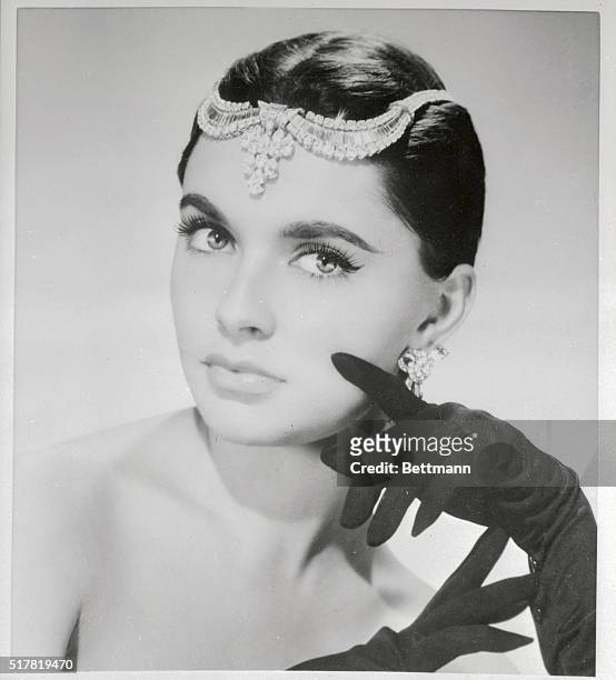 French movie starlet, Yvonne De Monlaur revives a style that served silent movie queens well as she wears a fabulous diamond tiara above her brow....