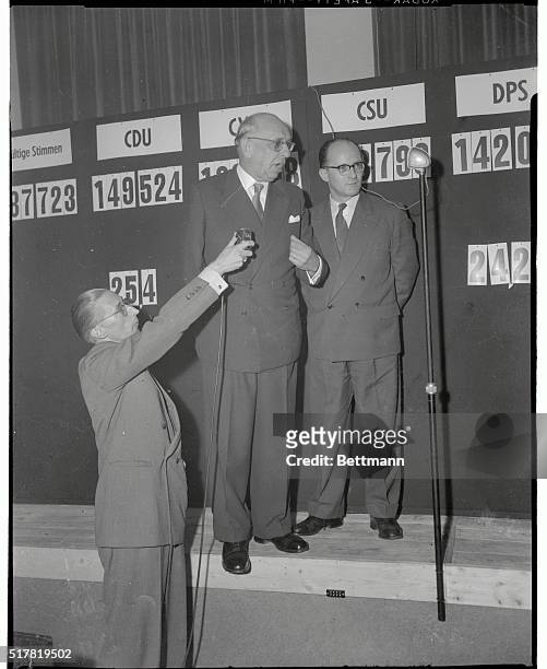 Dr. Hubert Ney , chairman of the pro-German Christian Democratic Union , makes a statement in front of the tabulation board after his party won the...