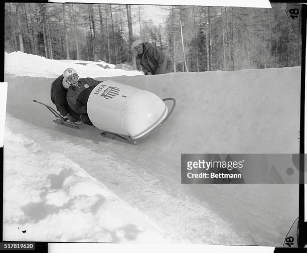 The two-man bobsled team of Bud Washbond, of Keene Valley, New York, and Patrick Biosadecki zoom down the fast Olympic bob tracks during the trial...