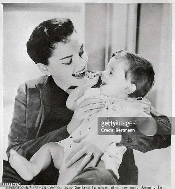Actress Judy Garland holds her son, Joseph, who is photographed for the first time since his birth a year ago. Joseph would make his photo proxy...