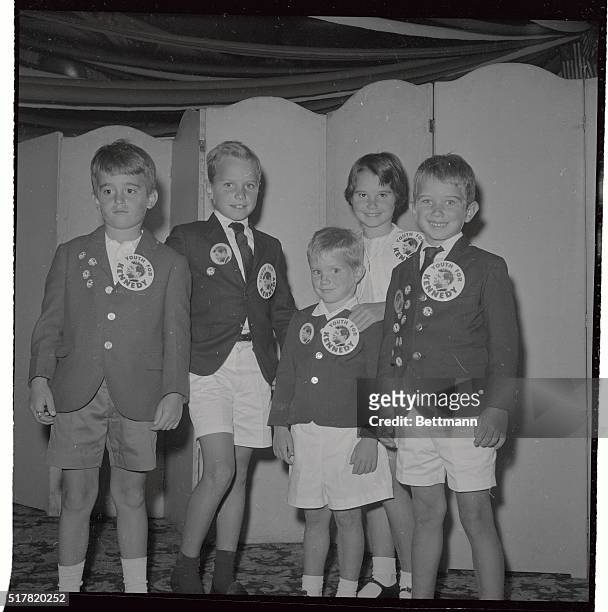 Left to right on the children posing with big Kennedy buttons on are Bobby Schriver son of Mrs. Sargent Schriver, one of the Kennedy sisters, next is...