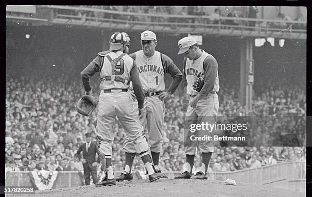 Red Manager Fred Hutchinson comes to mound to talk with Jim O'Toole and pitcher Darrell Johnson in first inning of World Series Opener. O'Toole had...