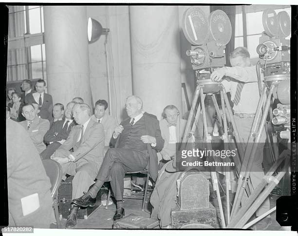 Secretary of State John Foster Dulles sat with newsmen and camera crews after reviewing the Arab-Israel dispute before the Senate Foreign Relations...