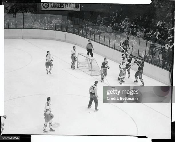 Little unscheduled action takes place during the first period of game at Madison Square Garden, as Lou Fontinato of the Rangers and George Armstrong,...