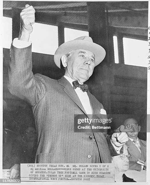 Mr. Cullen gives the U of H 2-1/2 million dollars...Here, shown at the University of Houston-Texas Tech football game in Rice Stadium giving the...