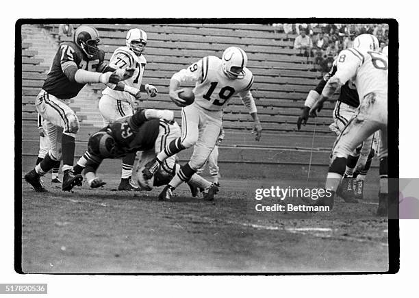 First quarter action in the Ram-Colts Game shows Colt Quarterback, Johnny Unitas, as he was thrown for a loss behind his own scrimmage line by Dave...