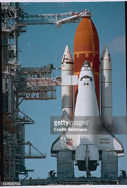 Cap Canaveral, Fla.: The space shuttle Discovery sits at the ready on its launch pad on the eve of its scheduled launch marking America's return to...