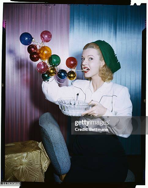 Pert Dale Evans, the Queen of the Westerns, who won a soap bubble blowing contest when she was a kid in Texas, tries her hand at wafting soap suds...