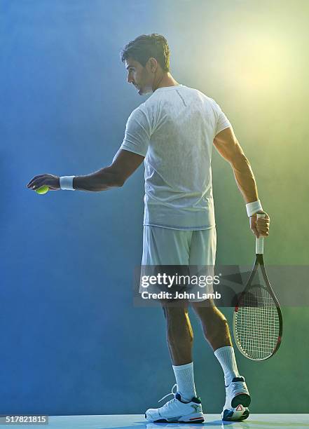 Man Using Tennis Racket 3,671 Man Holding Tennis Racket Stock Photos, High-Res Pictures, and ...