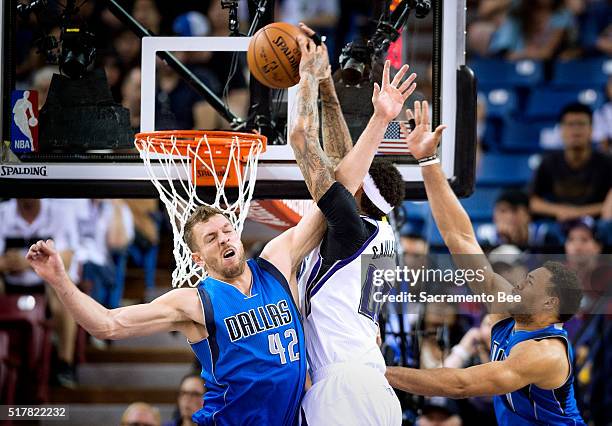 Sacramento Kings center Willie Cauley-Stein goes up strong for a dunk but misses it with tough defense by Dallas Mavericks forward David Lee and...