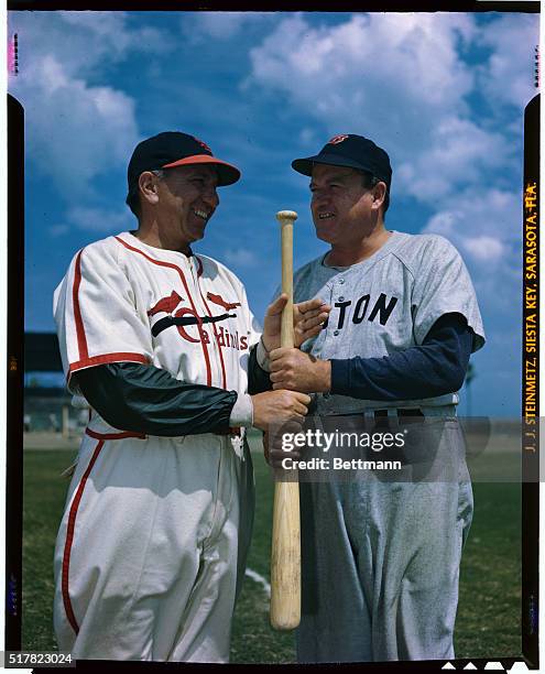 Photo shows Eddie Dyer, of the Cardinals, and Joe Cronin,, of the Boston red Sox, playing the "grip the bat to choose" game.