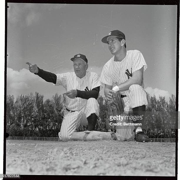 Manager Casey Stengel greets Billy Martin, , at the Yankee camp, after the star second baseman reported for spring training here. Martin was one of...
