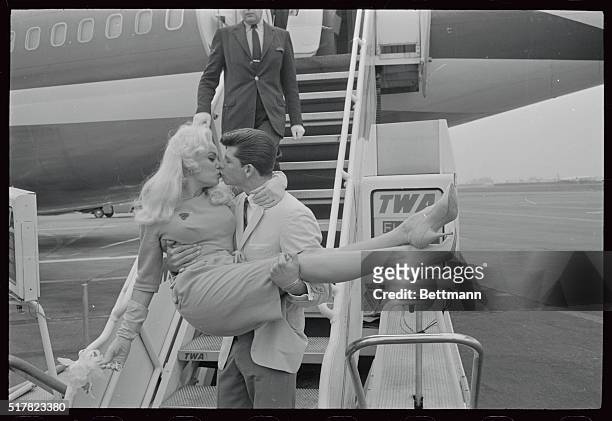 Blonde actress Mamie Von Doren and her 21 year old boyfriend, Anthony, Santoro of Hollywood, are shown at the International Airport before Mamie...