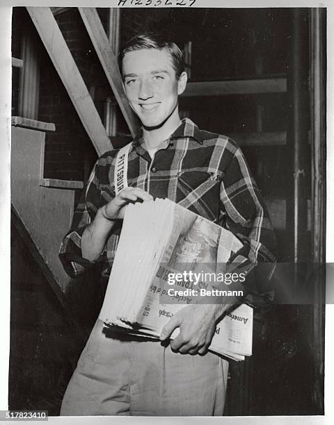 Earl Eisenhower, of Charleroi, Pennsylvania, 17-year-old nephew of President Eisenhower, is shown as he delivers newspapers on his hometown paper...