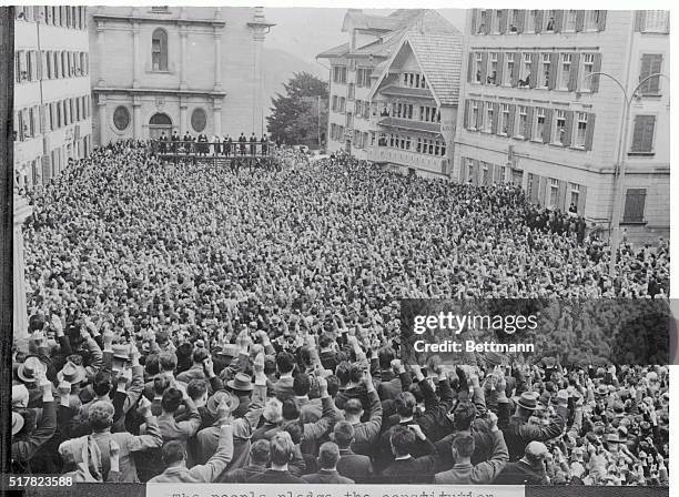 Appenzell, Switzerland: The People Speak. Crowded together in one of the open-air parliaments through which many small Swiss communities govern their...