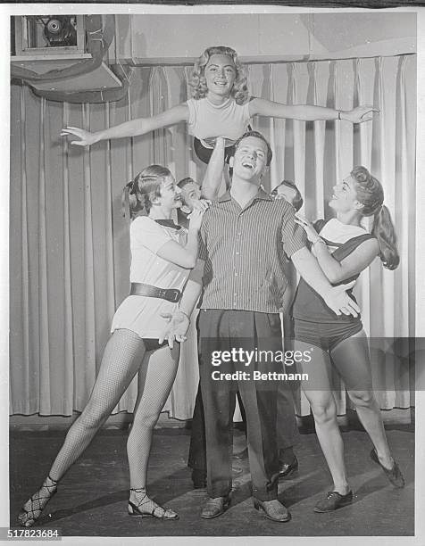 Pat Boone runs through a routine with the dance group of ABC-TV's The Pat Boone Chevy Showroom.