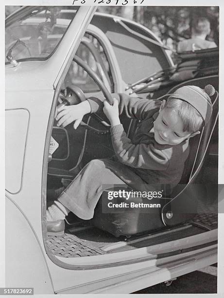 Robertino Rossellini, son of actress Ingrid Bergman and her director husband, Roberto Rossellini, driving a vehicle in Naples, Italy.