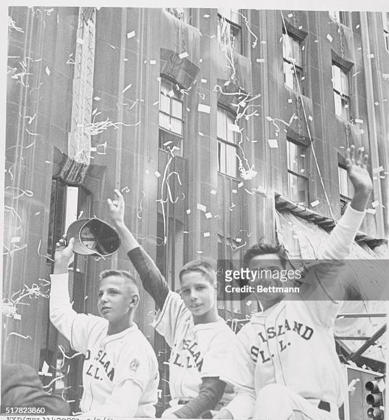 New York: Enjoying the traditional ticker-tape parade up lower Broadway, , William Ebner, Gregory Klee, and Daniel Yaccarino, members of Island's...