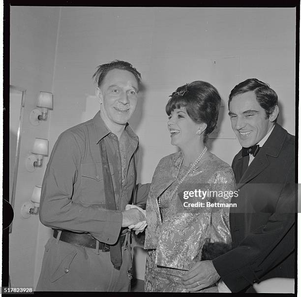 Canadian actor Christopher Plummer, star of the new david Merrick production Arturo UI, is visited in his dressing room after the first performance...