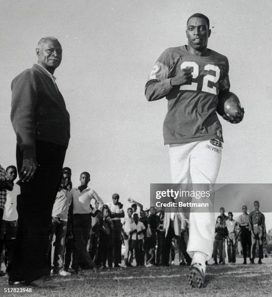 Bob Hayes, the world's fastest human, works out here 10/30 in preparation for his first football action of the season, as Florida A&M coach Jake...