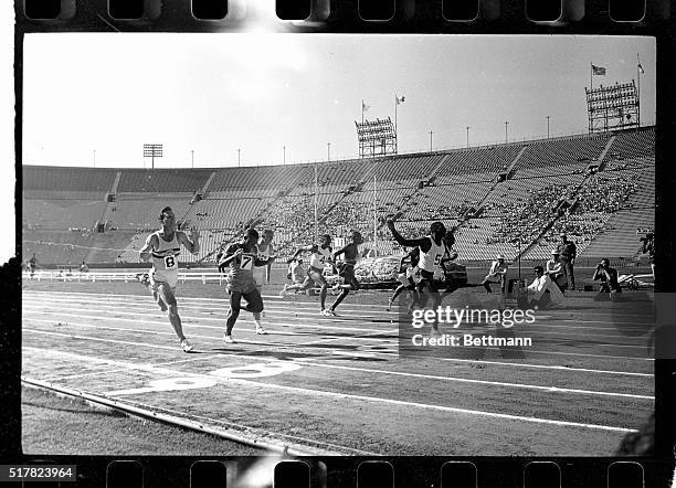Bob Hayes of Florida A&M breaks the tape to win the 100-meter dash and win a seat on the US Olympic Team. Hayes, off to a fast start was clocked in...