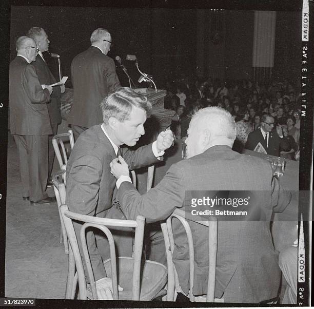 Robert F. Kennedy clenches his fist to stress a point as he talks with David Dubinsky, President of the International Ladies Garment Workers Union,...