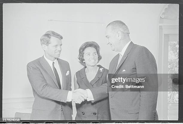 Robert F. Kennedy syas goodbye to President Johnson at the White House today after resigning as Attorney General in order to seek his first elective...