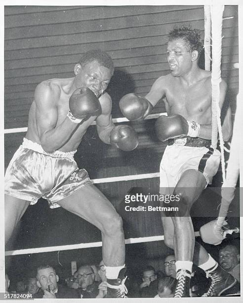 Former world middleweight champion Sugar Ray Robinson fights back from the ropes at Johnny Angel, of Nigeria during their scheduled 8 round fight in...
