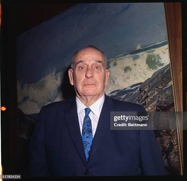 New York. Robert Moses, president of the World's Fair Corp., is shown in Huntington Hartford's gallery of Modern Art today, March 16th, during...