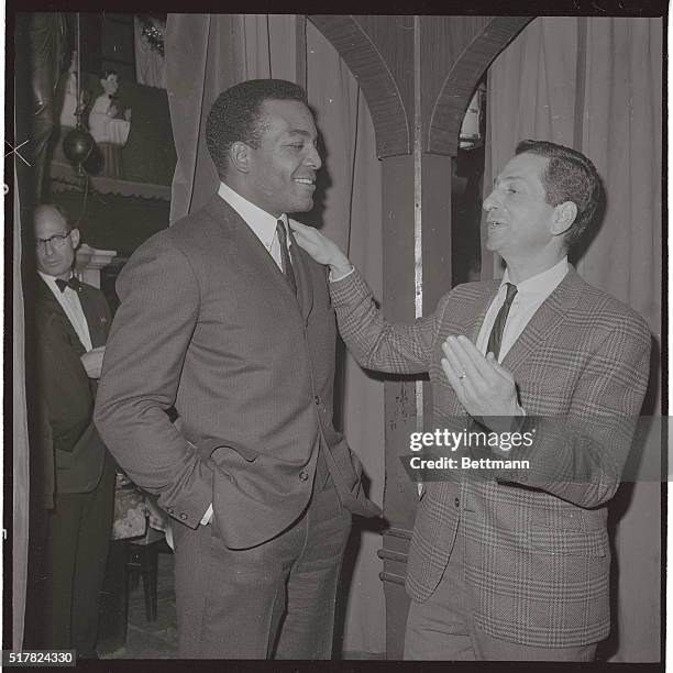 New York Giants' coach Allie Sherman seems to be saying "things would have been different it I had you" to the Cleveland Browns' fabulous fullback...