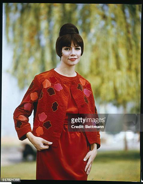 Delicate applique...Two shades of red velvet present a bright scene for Fall 1963 with delicate applique marking the jacket of this ensemble. Rome...