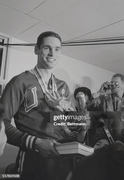 Olympics' Fred Hansen smiles broadly as he wears his Gold Medal he won in the pole vault event, setting a new Olympic record of 16'9".