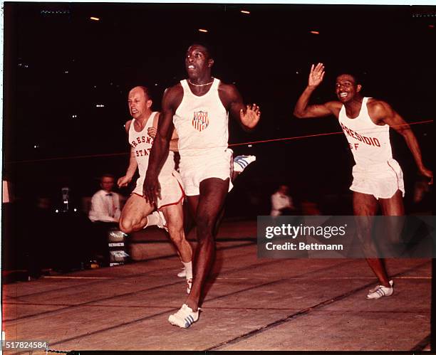 Bob Hayes, of Florida A&M winning the 60 yard dash event finals to tie the world record of 6 seconds flat.