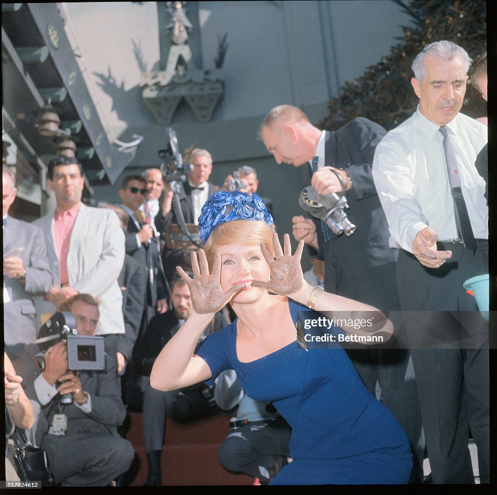 Debbie Reynolds Showing Cement-Covered Hands