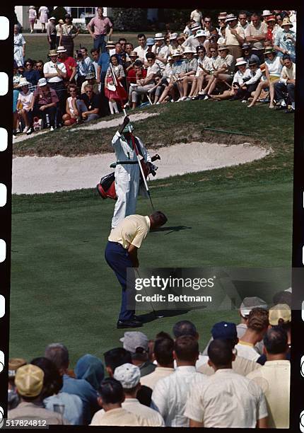 Augusta, Ga.: Arnold Palmer putts on the 9th green in the second round of the Masters Tournament at the Augusta National Golf Course today.