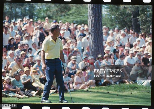 Augusta, Ga.: Arnold Palmer putts and misses on tenth hole during Masters Golf Tourney.